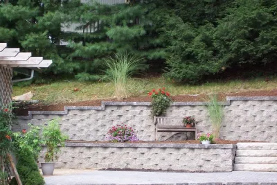 Backyard Patio with Multi-tier Retaining Wall — Landscape Construction project by Majestic Services Of Michigan