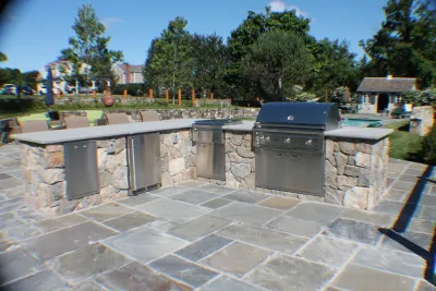 Outdoor Kitchen & Pool by Martino Landscape Contractors Inc