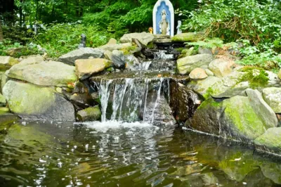 Waterfall | Koi Pond | Thornwood NY — Landscape Construction project by MG's Lawn Green Inc