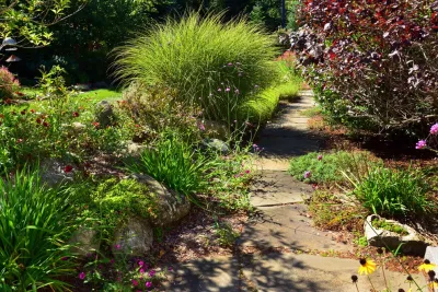 Natural Landscaping with Stone Walkway by Michael Therrien Landscaping, LLC