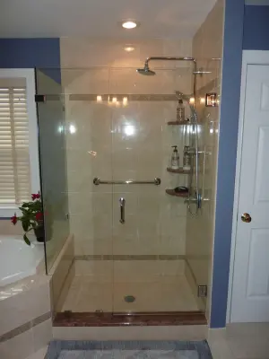 Custom Oversized Tiled Showers with Frameless Glass by Mattioni, Inc