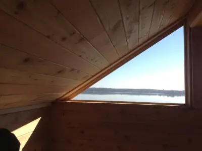 Cedar Room Expansion and Cedar Deck with Glass Railing at Chain O' Lakes by Countryside Plumbing Sewer And Septic