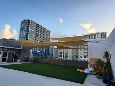 Rooftop Shade Sail Design — Landscape Construction project by Natur Landscape Creations in Miami