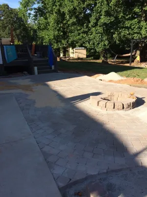 Paver Patio w/ Fire Pit & Seating Wall — Landscape Construction project by New Garden Landscaping & Nursery