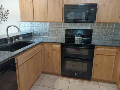 Updated countertop and metal backsplash — Interior Design & Decorating project by SKD Interiors LLC