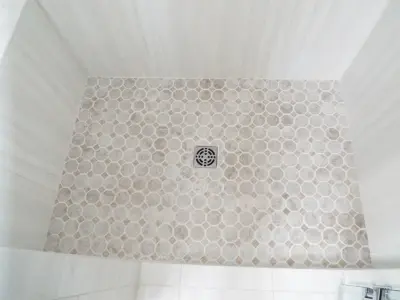 Custom Glass Shower in Tile and Granite Bathroom — Home Renovation & Remodeling Services project by Gesang Remodeling