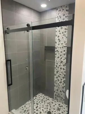 Shower Tile Installation with Barn Glass Door — Home Renovation & Remodeling Services project by Backwoods Home Improvements