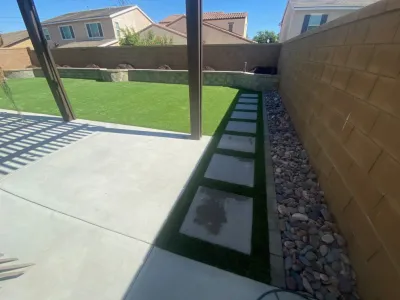 Artificial Grass with Pavers | Design & Install — Landscape Construction project by Oasis Turf & Hardscape