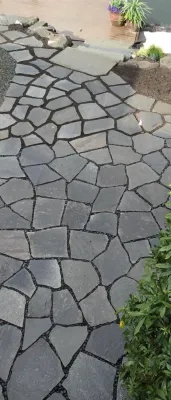 Rustic Natural Stone Patio — Landscape Construction project by Olympic Rockeries in Seattle