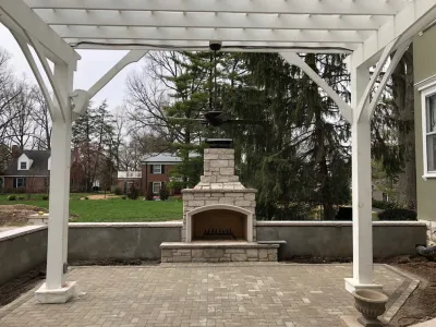 Grand Side Entry Patio, Walls, Columns, Fireplace, Pergola — Landscape Construction project by Outdoor Creative Design