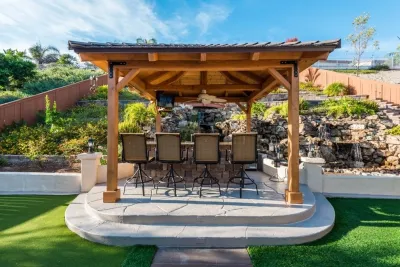 Patio Cover, Outdoor Kitchen and Water Feature by Pacific Dreamscapes