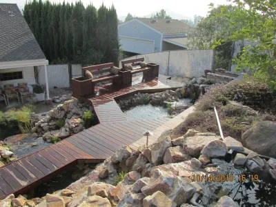 Pond with waterfalls and decks — Landscape Construction project by Pacific Dreamscapes