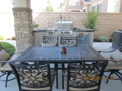 Patio cover, concrete and outdoor kitchen in Carmel Mountain, San Diego CA by Pacific Dreamscapes