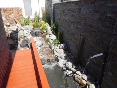 Pond and waterfall in difficult spaces by Pacific Dreamscapes