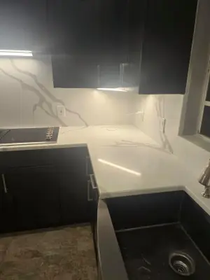 Light Stone and Dark Cabinetry — Home Renovation & Remodeling Services project by Level Up Construction & Investment Group LLC