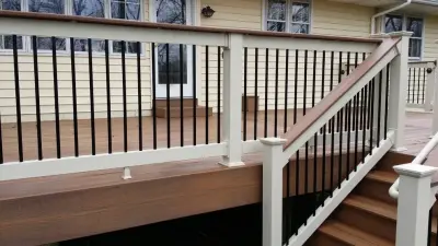 Ipe Fiberon deck with lighting and railing cap by Coastal Outdoor Spaces