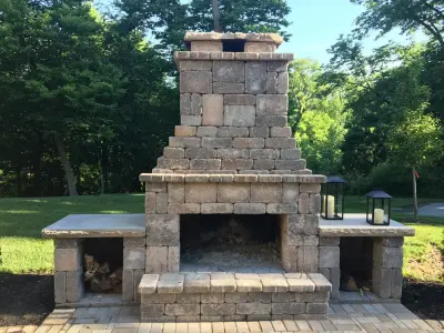 Parkville Outdoor Living Space with Patio, Pergola, and Fireplace by Kansas City Hardscapes