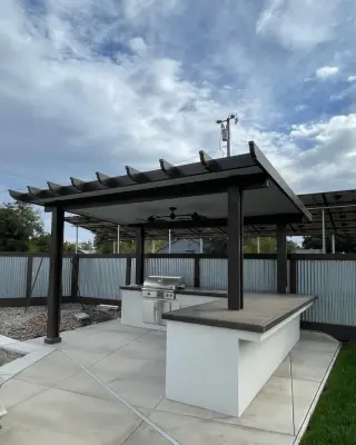 Outdoor Kitchen with BBQ Pavilion by SC Construction