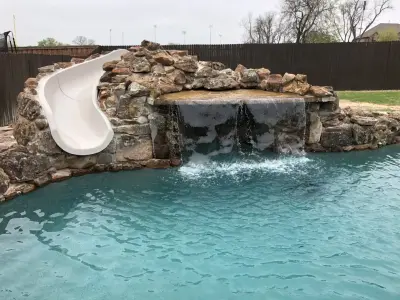 Plano, Grotto, and Large Pool Slide — Deck Building & Repair project by Ortus Exteriors