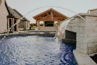 Outdoor Oasis: Pool, Water Features, Slides, and Fire Elements — Deck Building & Repair project by Ortus Exteriors