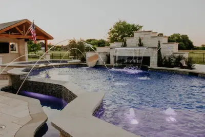 Outdoor Oasis: Pool, Living Space, Water Slide, and Fire Features — Deck Building & Repair project by Ortus Exteriors