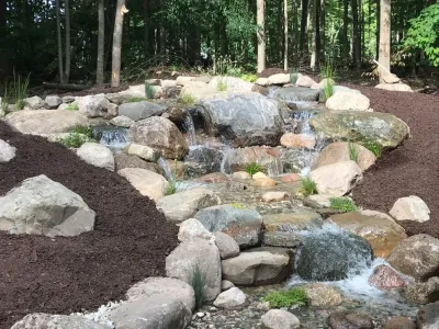Large Pondless Water Feature Installation Grand Rapids, MI — Landscape Construction project by Platinum Ponds & Landscaping