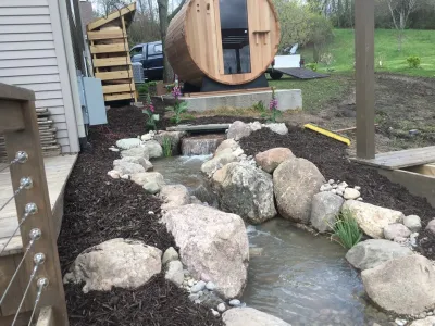 Water Feature Water Falls Installation Grand Rapids, MI — Landscape Construction project by Platinum Ponds & Landscaping