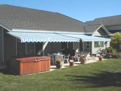 Side-by-Side Retractable Patio Awnings — Deck Building & Repair project by Creative Awnings & Shelters, Inc.
