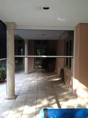 Rubenstein Coconut Grove Electric Retractable Screens by Sentinel Retractable Screens, LLC