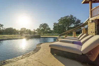 Cedar Ruby Ranch Pool with Waterslide by Southern Outdoor Appeal