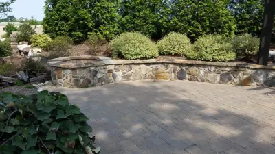 Patio and Retaining Wall with Fire Pit — Deck Building & Repair project by Simon Group