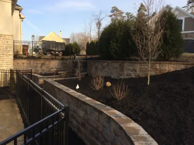 Tiered Structural Retaining Walls and Staircase by Pony Lawncare And Landscaping