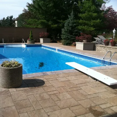 Paver Driveway and Pool by Pony Lawncare And Landscaping