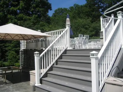 Expansive multi-tiered deck leading to pool — Deck Building & Repair project by American Deck Company
