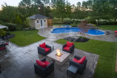 Charming Outdoor Patio with Fire Pit by M.C. Fence And Deck