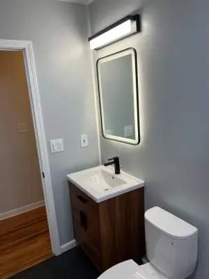 Compact Bathroom Renovation — Deck Building & Repair project by A-List LLC