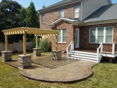 Trex Decking, Pergola, and Urbana Tumbled Pavers — Deck Building & Repair project by Deckscapes Inc