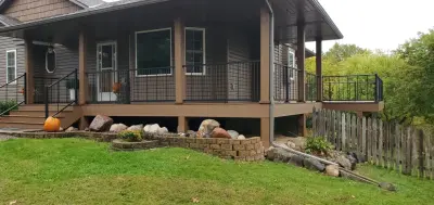 Trex Saddle and Beach Dune with Westbury Vertical Railings — Deck Building & Repair project by Rosebud Construction