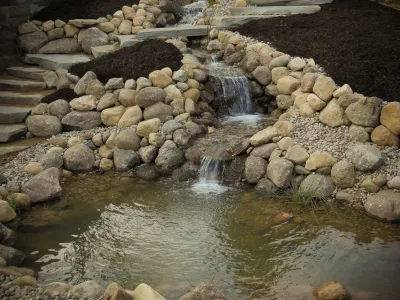 Christner landscape pond and water feature, waterfall, field stone and mulch — Landscape Construction project by Premiere Aquascapes