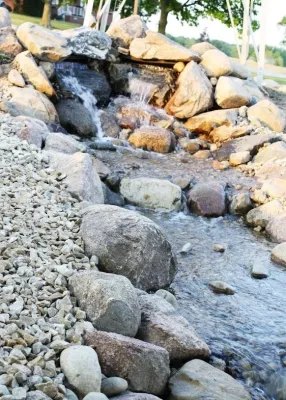 Pondless Waterfall Project, Fountainscape, Field stone edging and plants — Landscape Construction project by Premiere Aquascapes