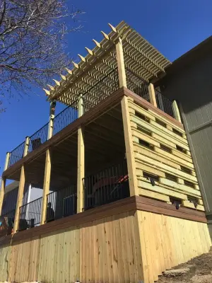 Two-Level Composite Deck Featuring Pergola and Privacy Wall — Deck Building & Repair project by The Deck Pro
