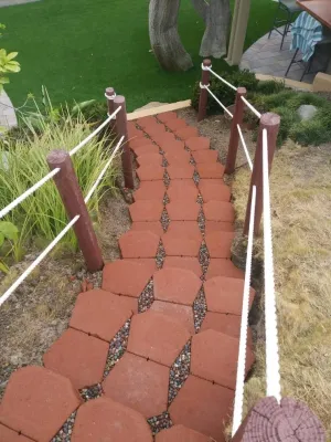 Keystone legacy steps with Jelly Bean pebble — Landscape Construction project by Quetzal Landscapes, Inc. in San Diego
