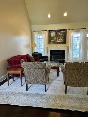 RISINGER - ENHANCED LIVING ROOM RUG AND FURNITURE ARRANGEMENT — Interior Design & Decorating project by Designs By Cheryl Lynn & Associates, LLC