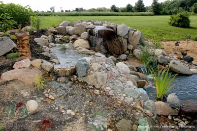Kalamazoo Water Feature - Water Feature Into Natural Pond — Landscape Construction project by R&A Landscaping
