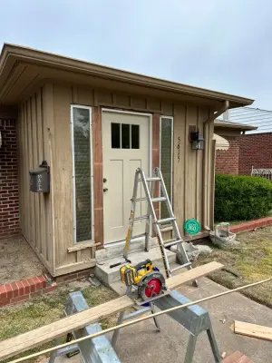 Decorative ironwork glass security storm door with fiberglass front entry — Deck Building & Repair project by Grand Deck Builders