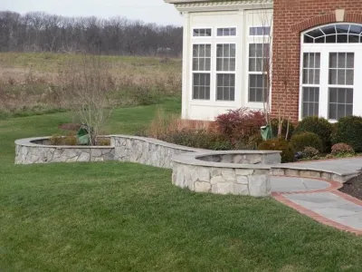 Brick & stone walkway with wall — Landscape Construction project by Rock Water Farm
