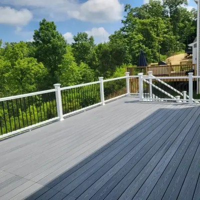 26x16 Composite Deck for Beach House with White PVC Railings and Black Aluminum Spindles by Jaguar Decks And Fences