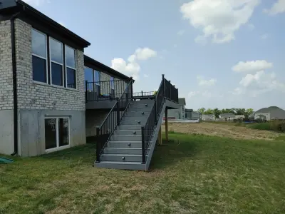 24x16 Composite Deck with 5-Foot Wide Steps and White Fascia Wrap, Including Solar Lights by Jaguar Decks And Fences