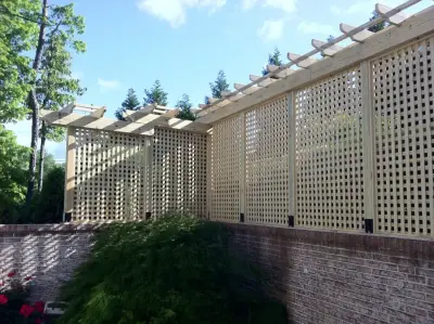 Appealing privacy barrier with a connected pergola by DeckThisOut