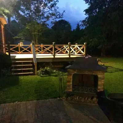 Outdoor deck featuring Chip and Dale railing — Deck Building & Repair project by Narron Woodworks
